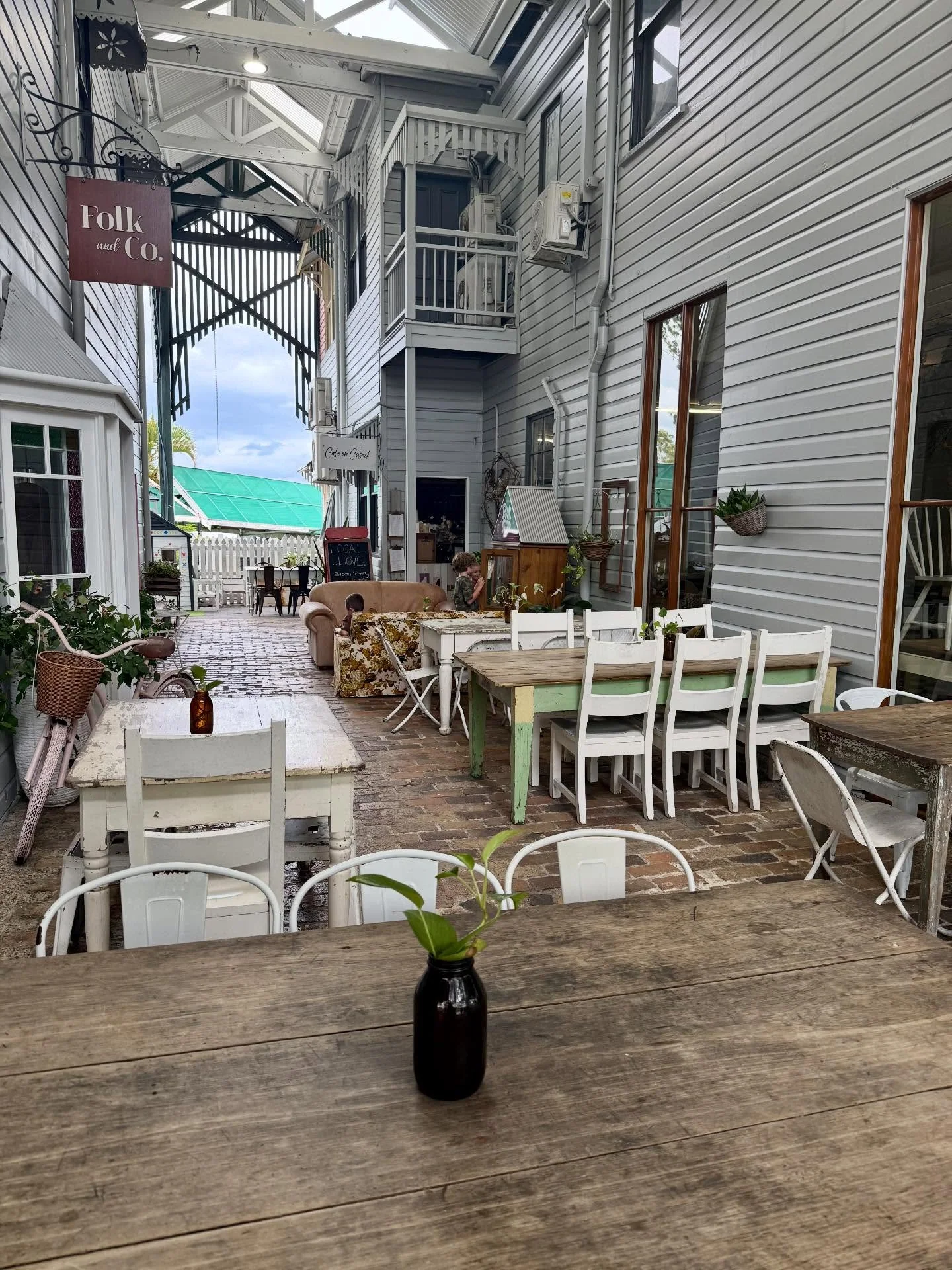 Outdoor tables beneath the veranda
